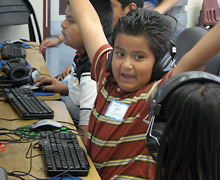 Boy raising arms in victory