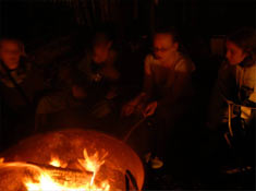 Kids around campfire
