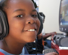 Boy with headphones, smiling
